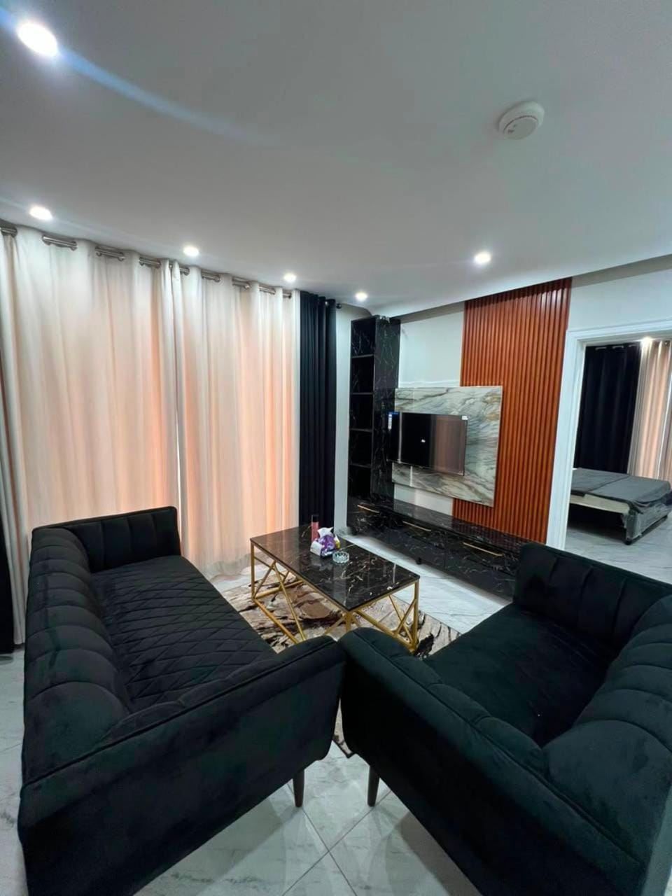 Property building, Communal lounge/ TV room, TV and multimedia, Living room, Seating area, Evening entertainment