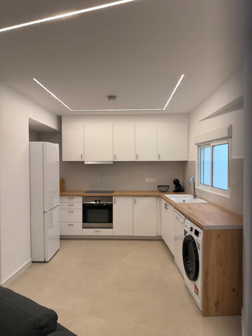 Kitchen or kitchenette, dishwasher, oven, stove, toaster, washing machine, dryer