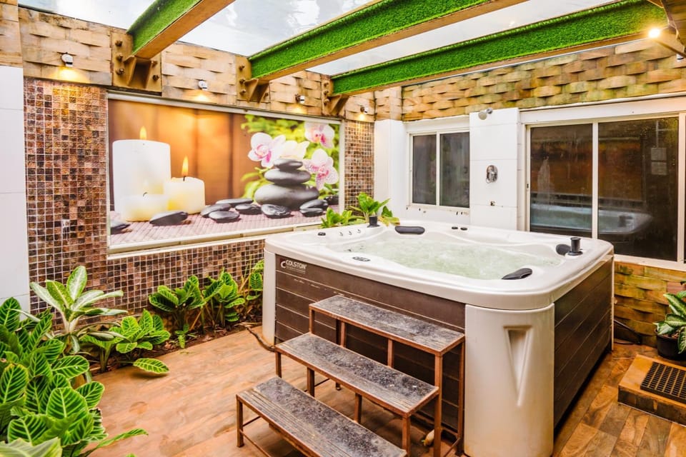ELIVAAS Signature Moonstone Meadows Suite By Alaya Stays With Shared Pool, Garden, Gazebo, & Jacuzzi Vacation rental in Lonavla