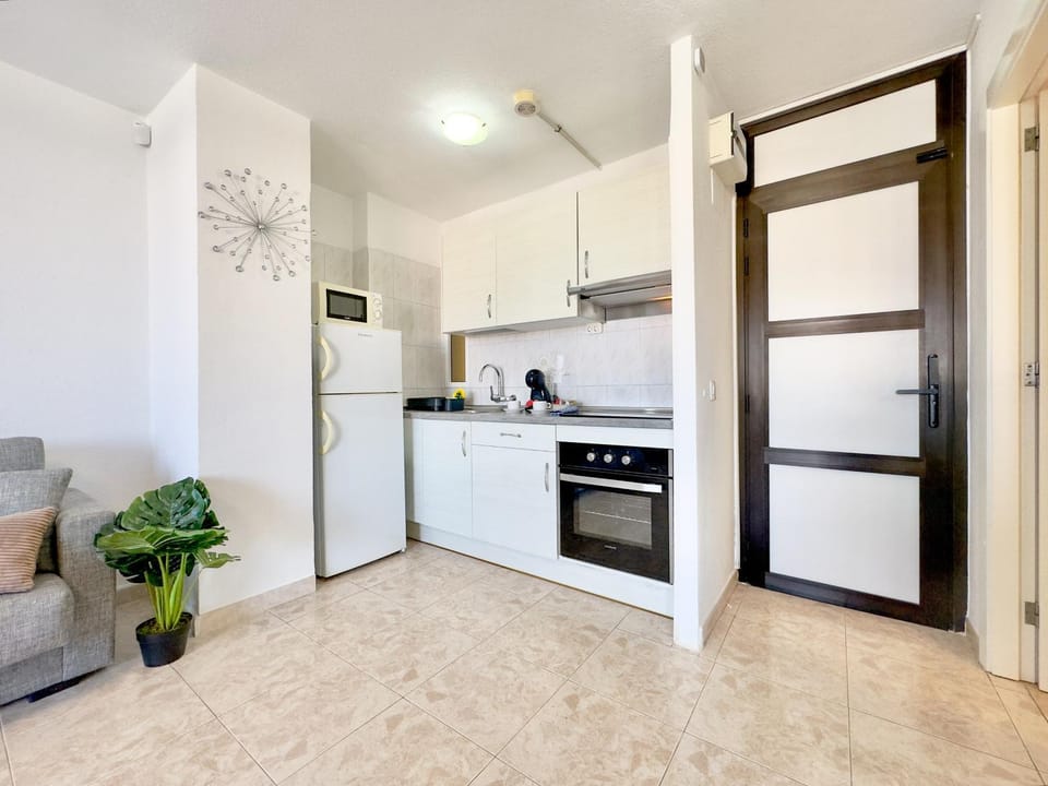 Kitchen or kitchenette, oven, stove, toaster