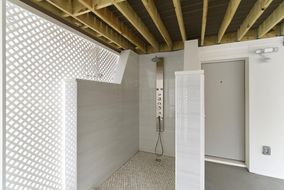 Luxury Beachside Escape in Seaside Heights 4BR 2BA Dual Kitchens and Living Rooms Fully Renovated Beach Badges Parking Outdoor Spa Shower House in Seaside Heights