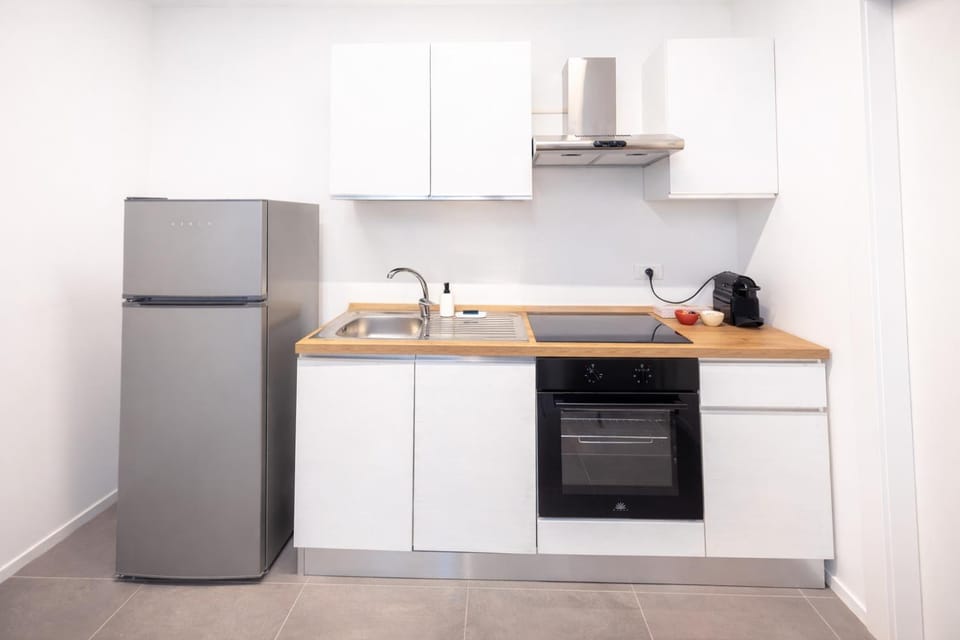 Kitchen or kitchenette, dishwasher, oven, stove