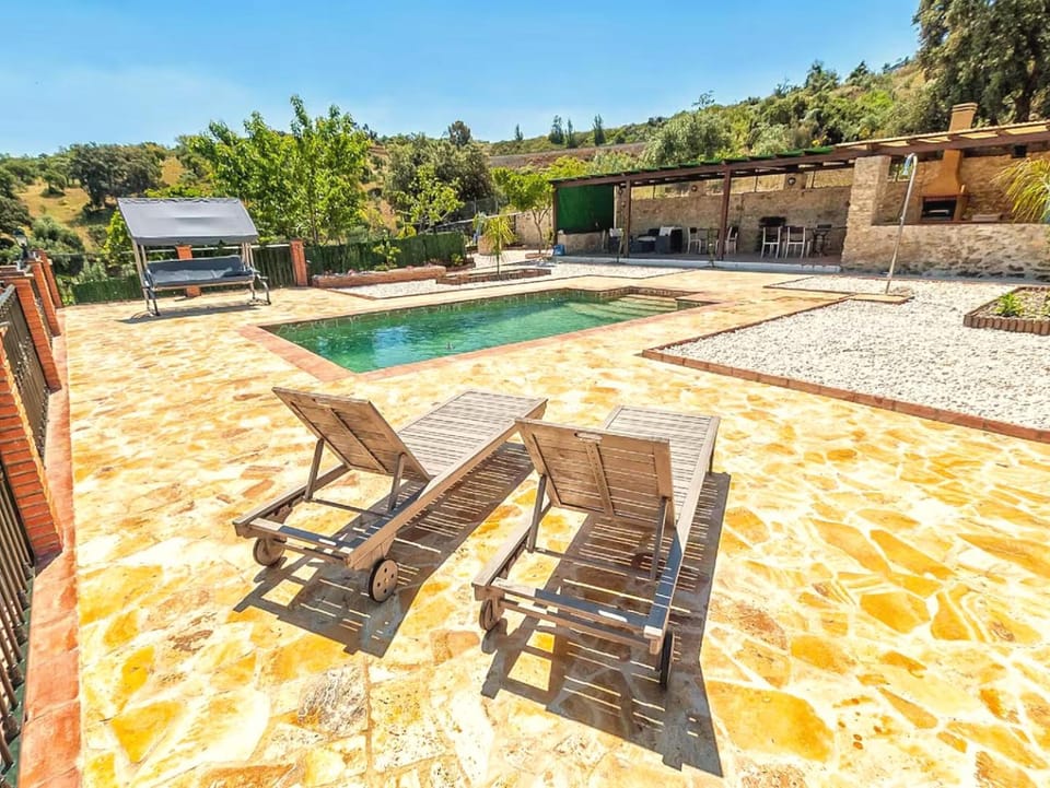 Patio, Day, Natural landscape, Pool view, Swimming pool, sunbed