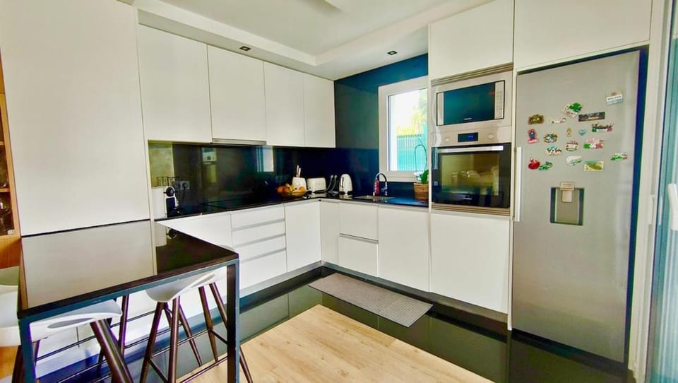 Kitchen or kitchenette, dishwasher, oven, stove, toaster