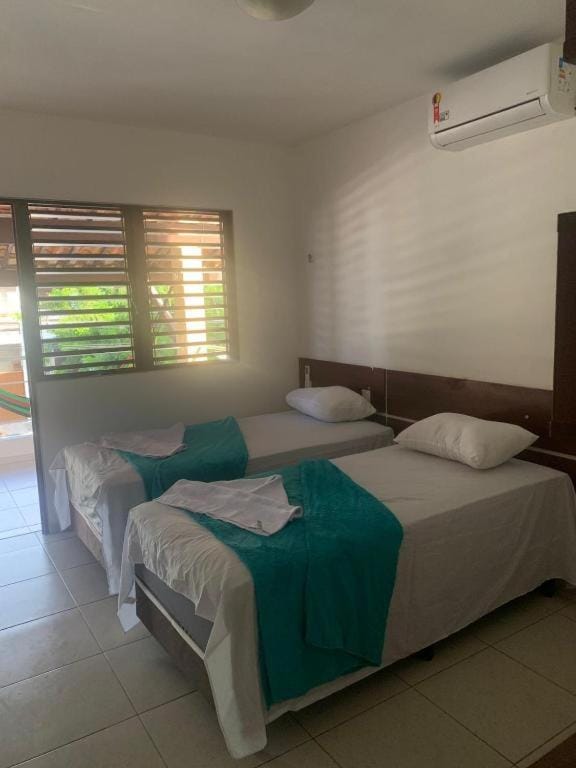 Bed, Photo of the whole room, towels, air conditioner