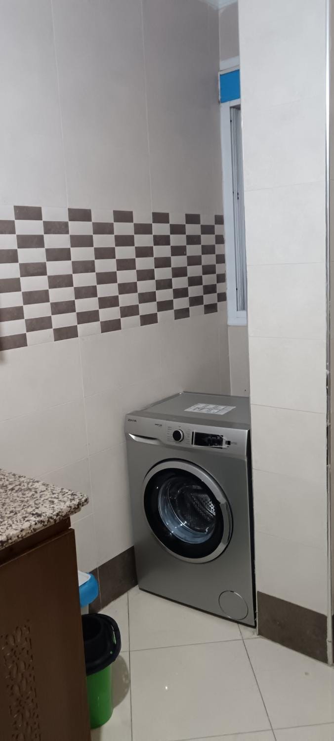 Kitchen or kitchenette, washing machine