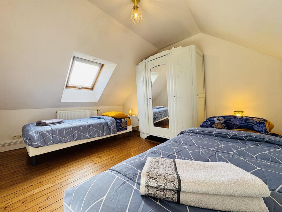 Bed, towels, wardrobe