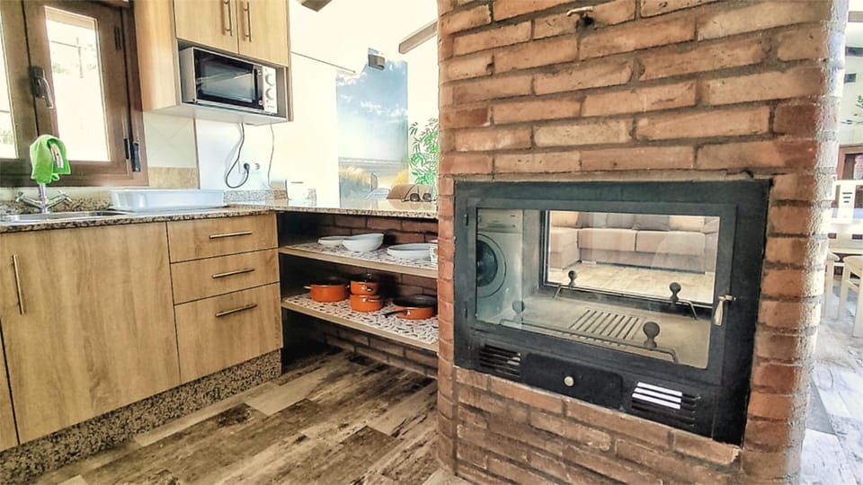 Kitchen or kitchenette, microwave, oven, stove