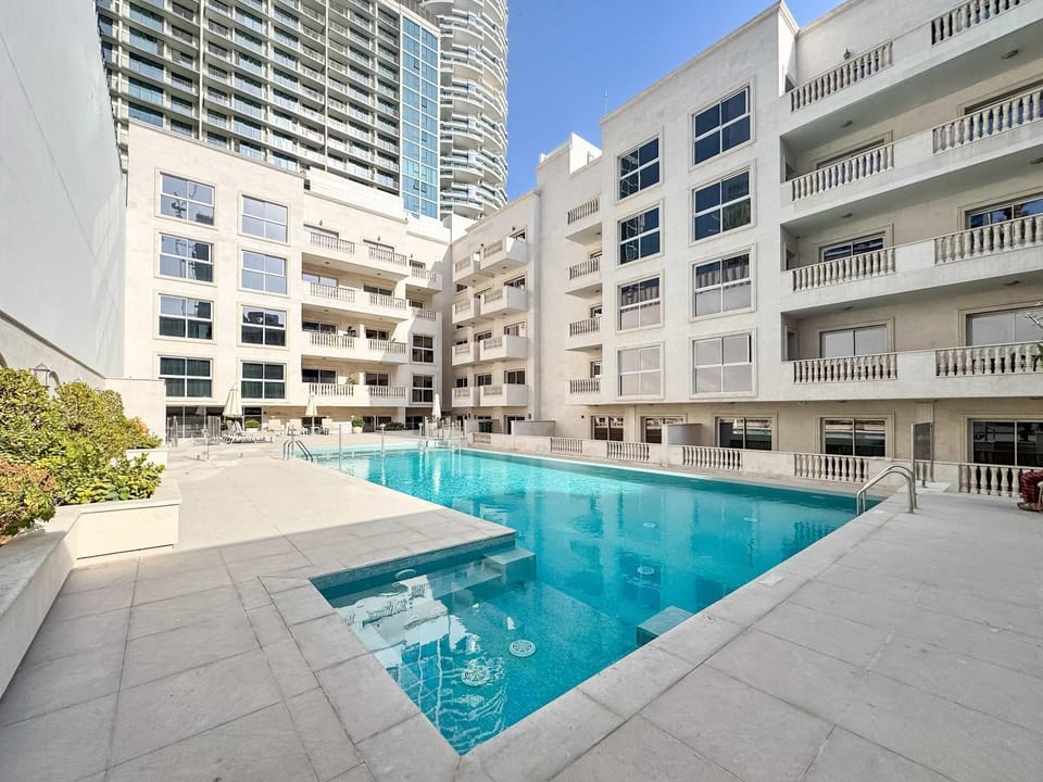 Property building, Day, Pool view, Swimming pool, sunbed