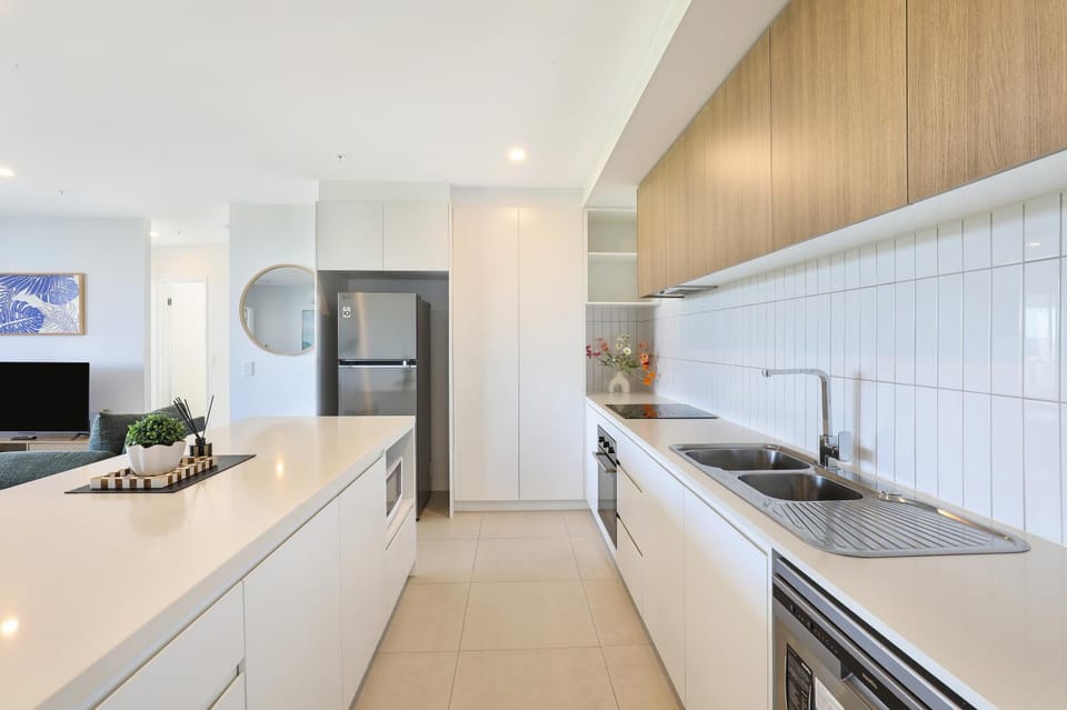 Kitchen or kitchenette, dishwasher, oven, stove
