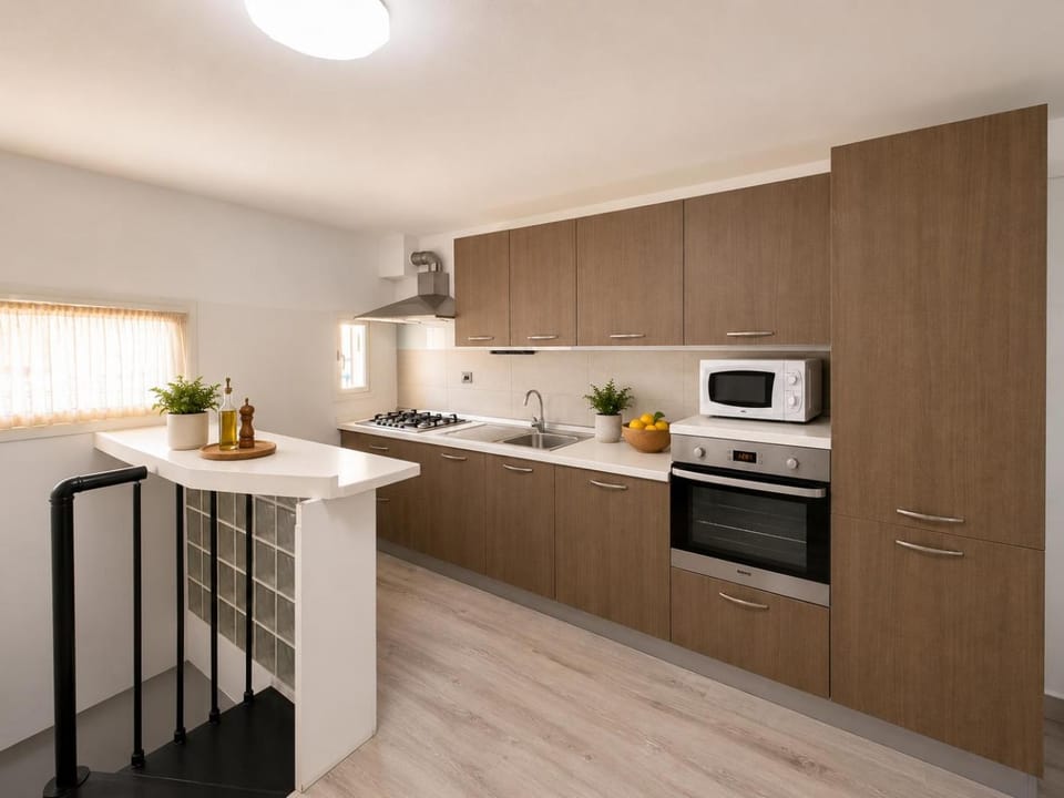 Kitchen or kitchenette, dishwasher, oven, stove
