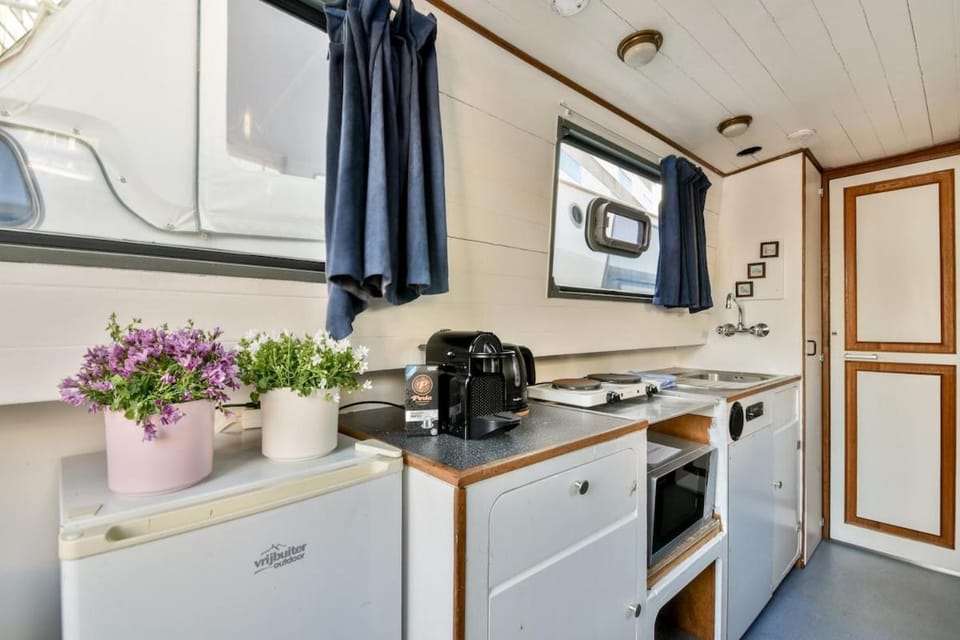 Orginal Dutch houseboat city center 'ZIJP' Docked boat in Amsterdam