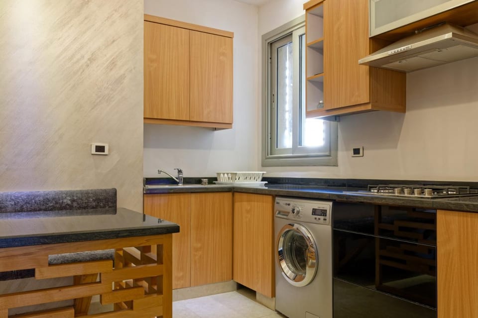 Kitchen or kitchenette, stove, washing machine