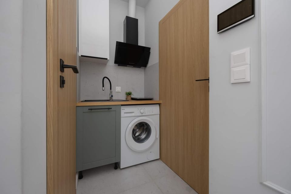 Kitchen or kitchenette, stove, washing machine