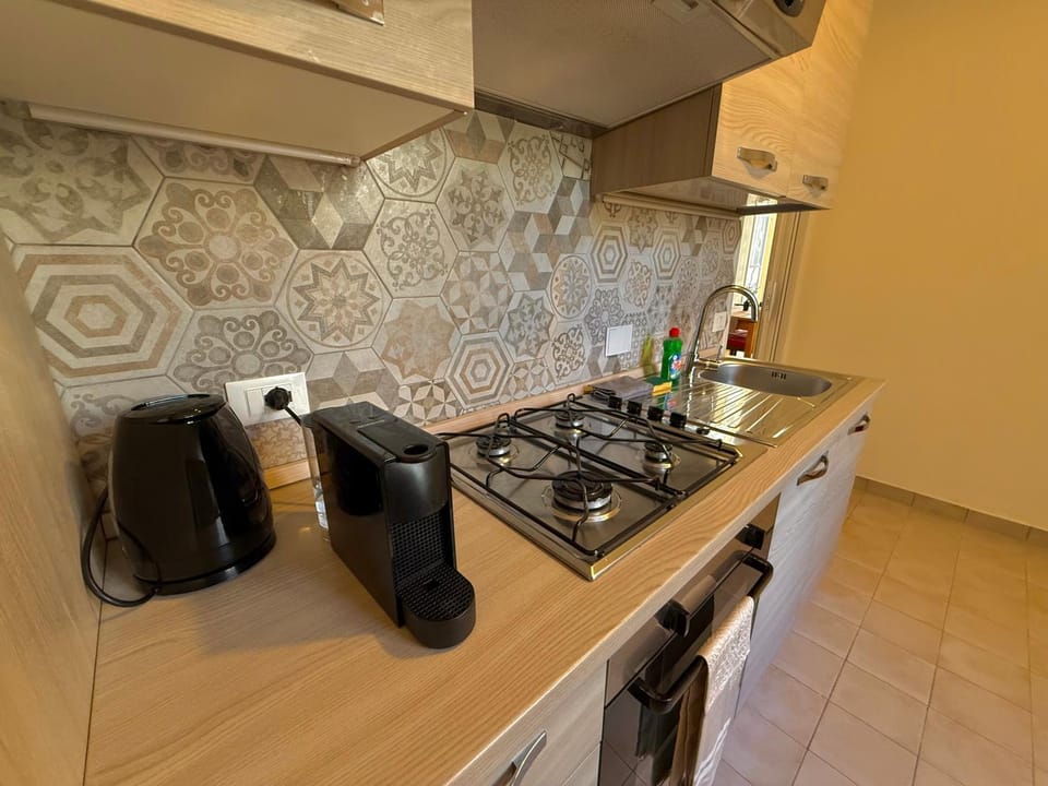 Kitchen or kitchenette, dishwasher, stove, washing machine