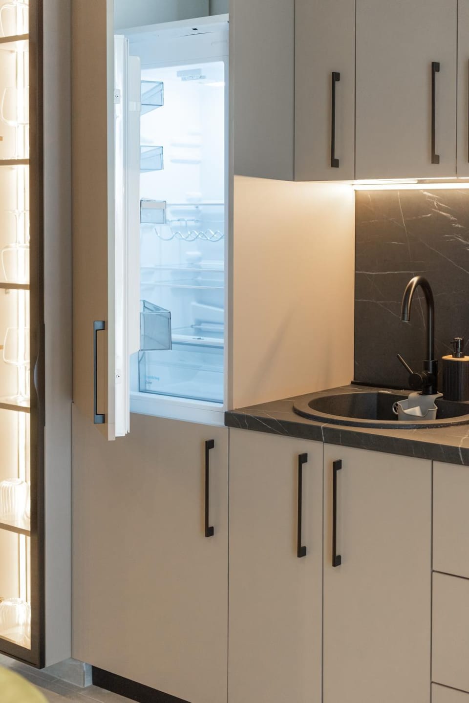 Kitchen or kitchenette, dishwasher, oven, stove