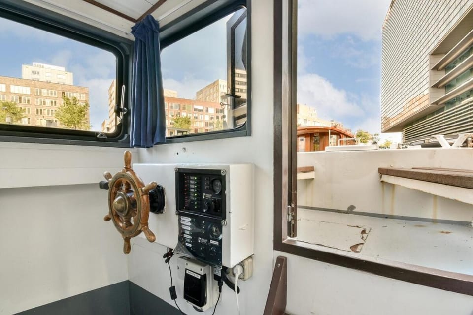 Orginal Dutch houseboat city center 'WIEL' Docked boat in Amsterdam