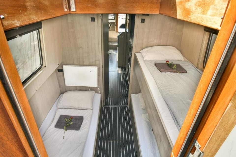 New houseboat city center 'Cruijff' Docked boat in Amsterdam