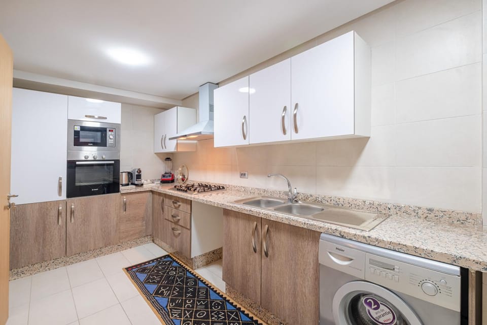 Kitchen or kitchenette, oven, stove, washing machine