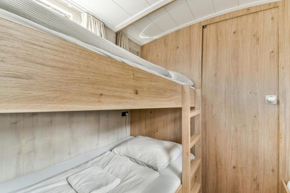 Authentic houseboat city center 'Loosdrecht' Docked boat in Amsterdam
