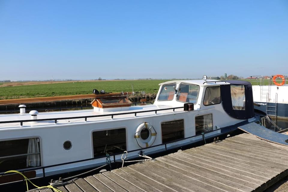 Authentic houseboat city center 'Loosdrecht' Docked boat in Amsterdam