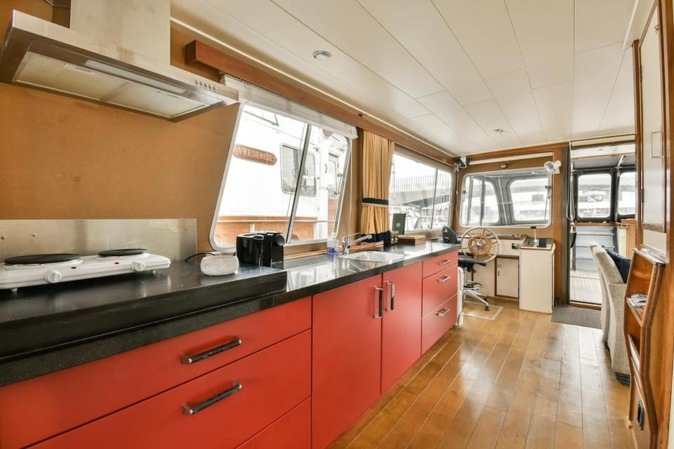Authentic houseboat Amalia Docked boat in Amsterdam