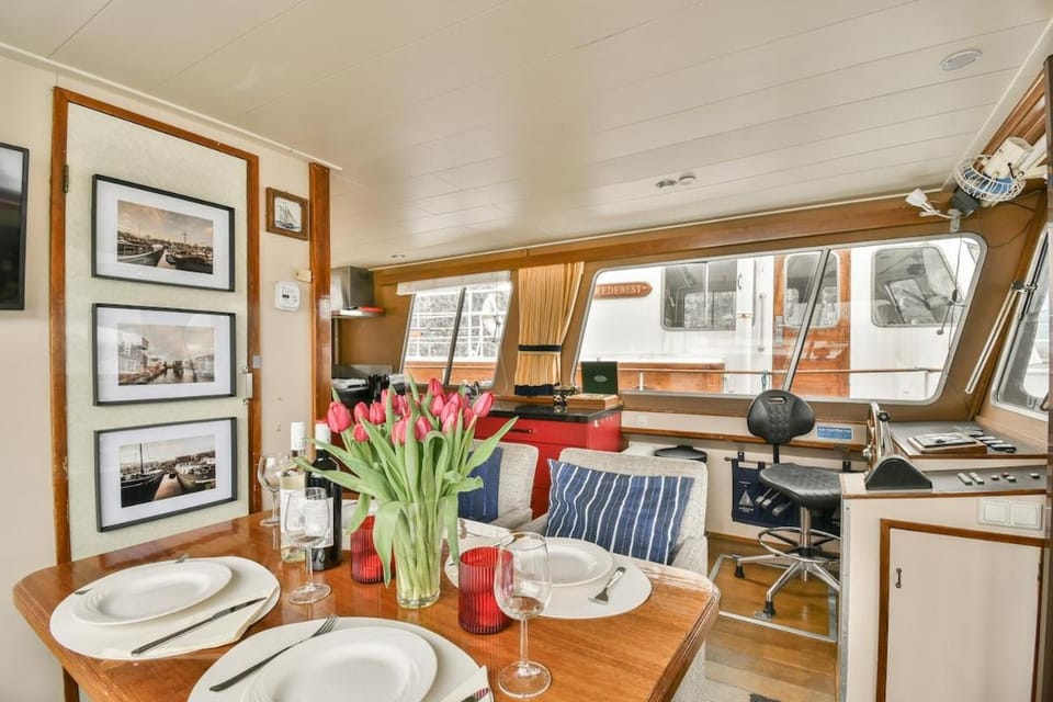 Authentic houseboat Amalia Docked boat in Amsterdam
