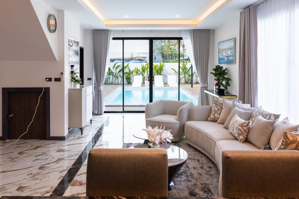 Living room, Seating area, Pool view