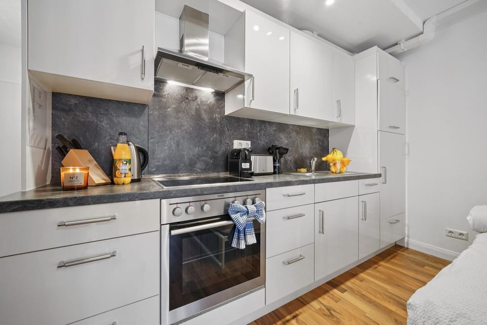 Kitchen or kitchenette, dishwasher, oven, stove, toaster