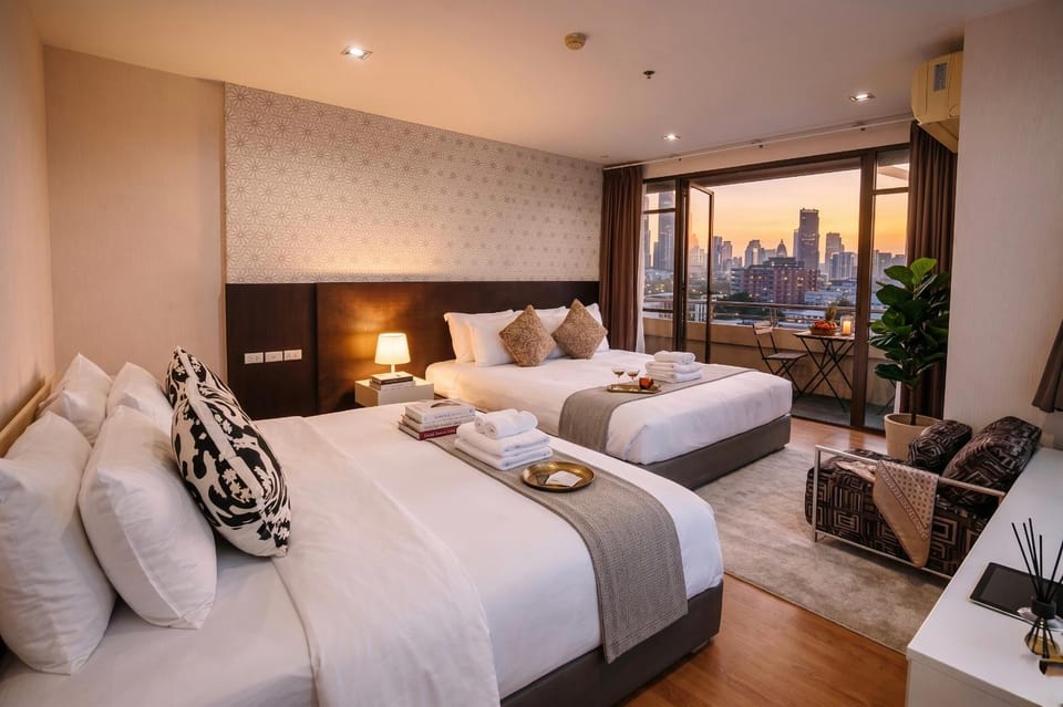 Large 6 Pax Bedroom with 3 Beds and Balcony next to Nana BTS Apartment in Bangkok