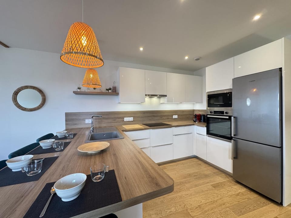 Kitchen or kitchenette, dishwasher, oven, stove, toaster