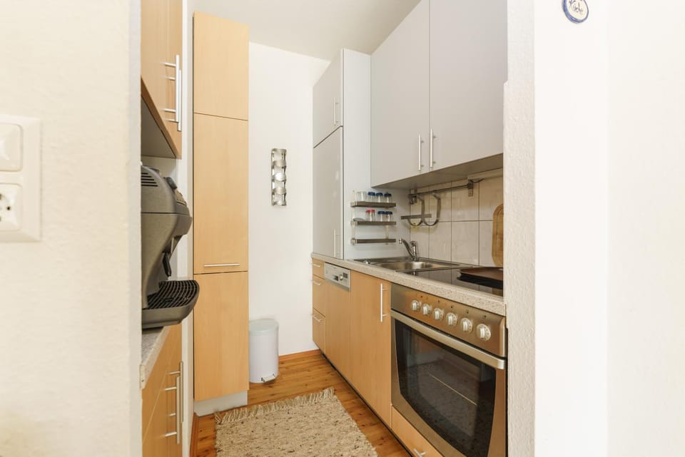 Kitchen or kitchenette, dishwasher, oven, stove