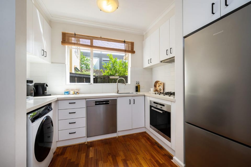 Kitchen or kitchenette, oven, stove, washing machine
