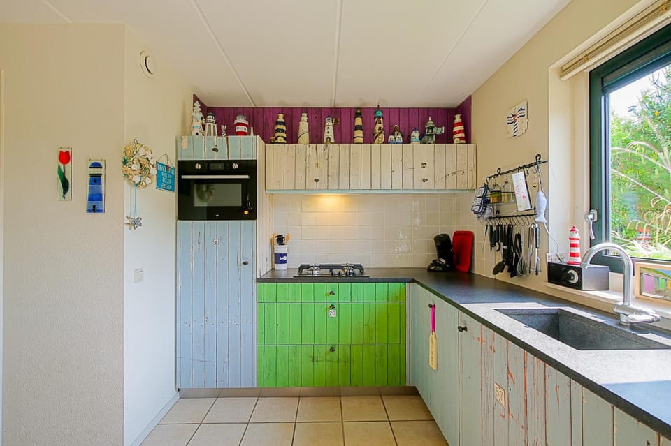 Kitchen or kitchenette, dishwasher, oven, stove