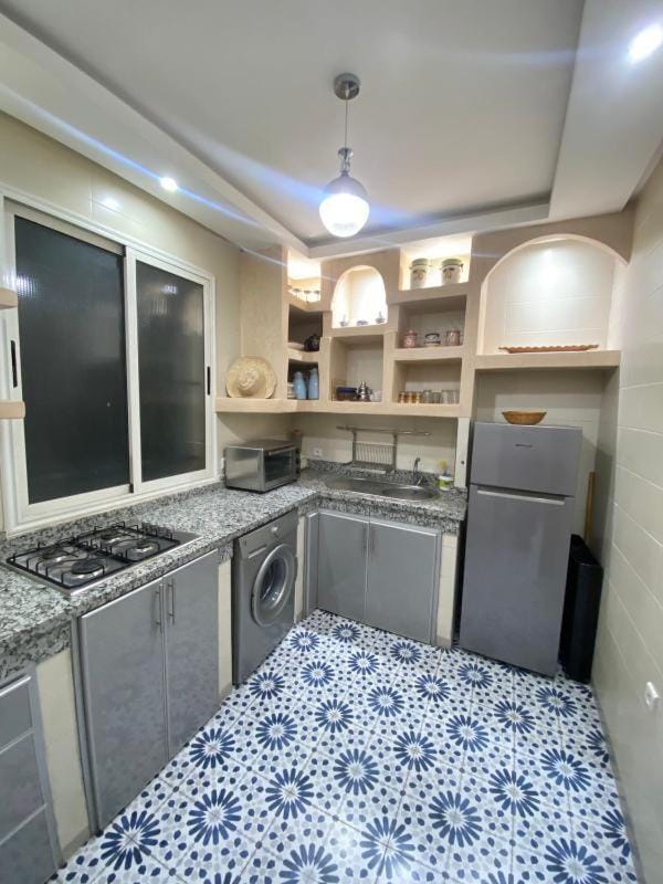 Kitchen or kitchenette, oven, stove, washing machine