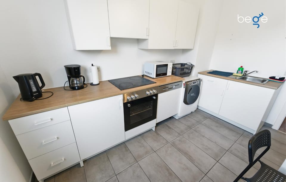 Kitchen or kitchenette, dishwasher, microwave, stove, washing machine, kitchen