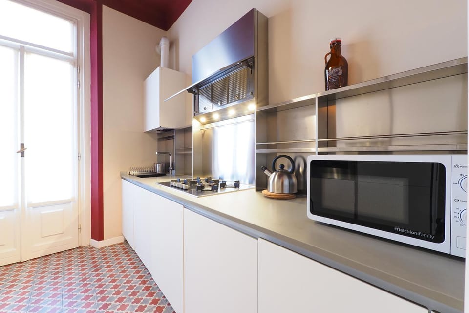Kitchen or kitchenette, dishwasher, oven, stove