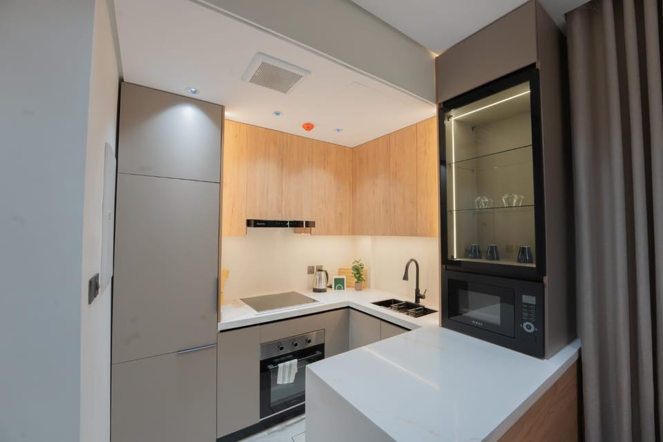 Kitchen or kitchenette, dishwasher, oven, stove