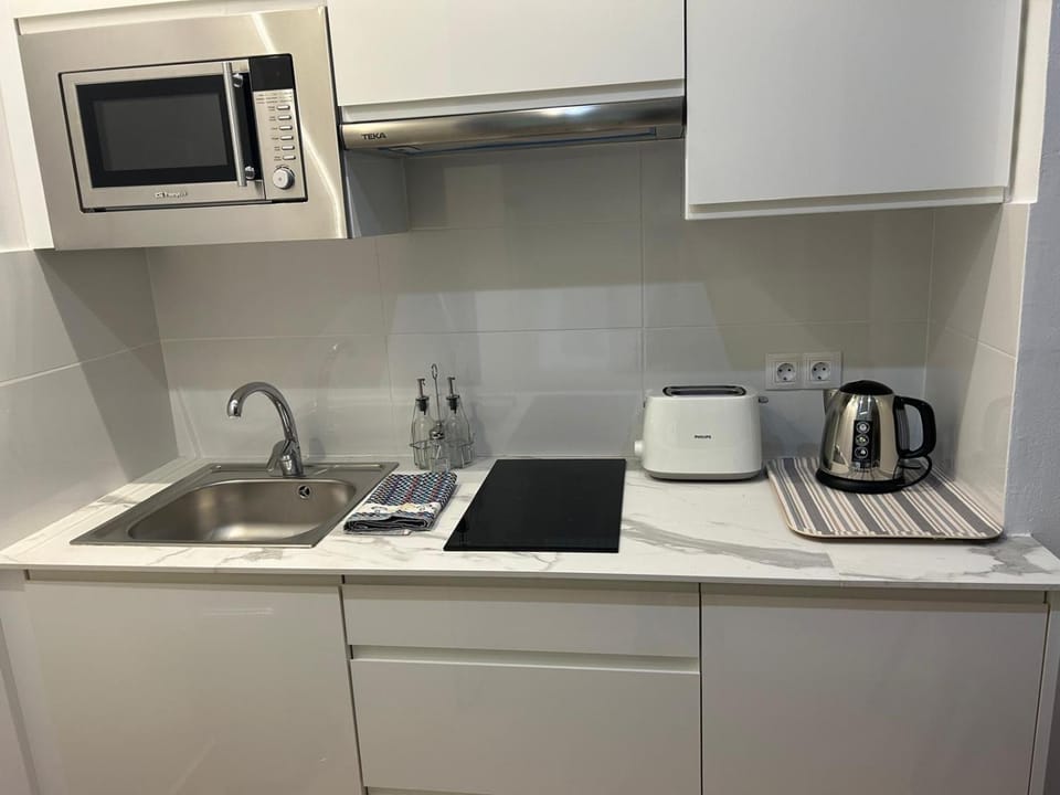 Kitchen or kitchenette, stove, toaster