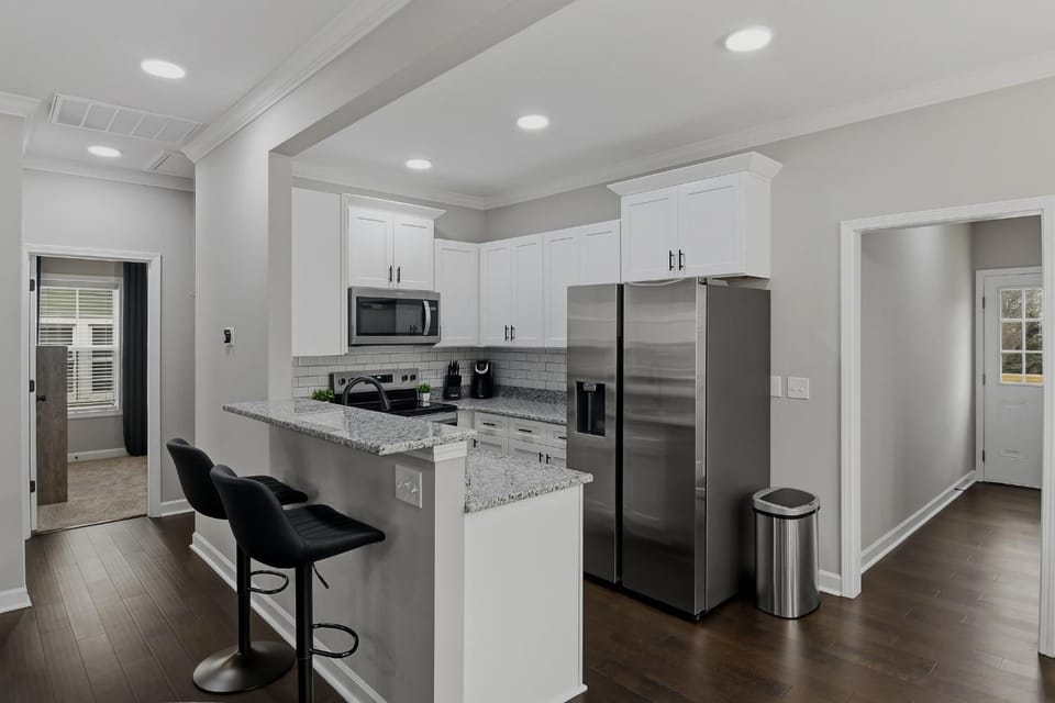 Kitchen or kitchenette, dishwasher, oven, stove