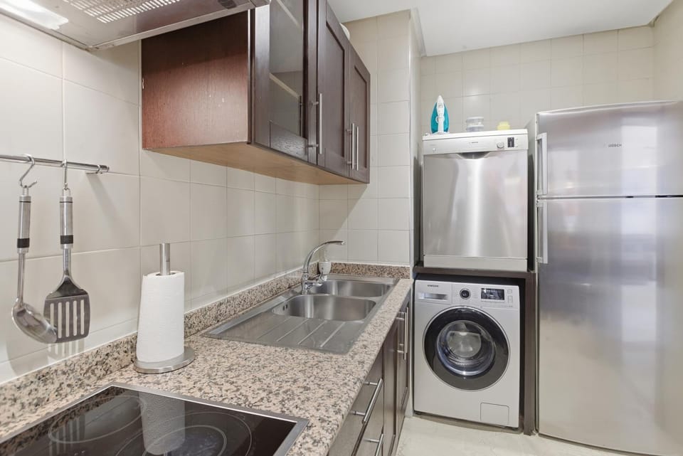 Kitchen or kitchenette, dishwasher, oven, stove, washing machine