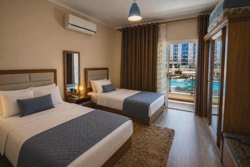 ابراج الداون تاون العلمين الجديده اطلاله البحر والبلااز بجوار فندق ريكسوس العلمين Apartment in Egypt