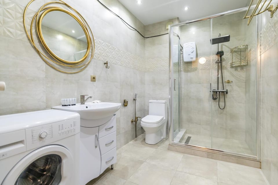 Shower, Toilet, Bathroom, towels, washing machine, dryer
