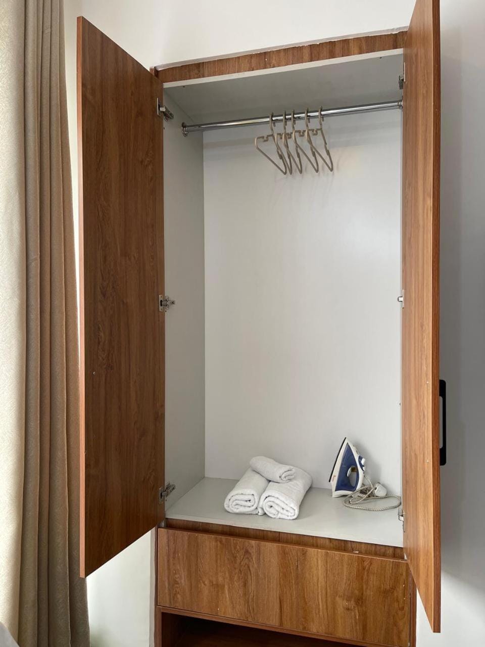 flat iron, towels, wardrobe