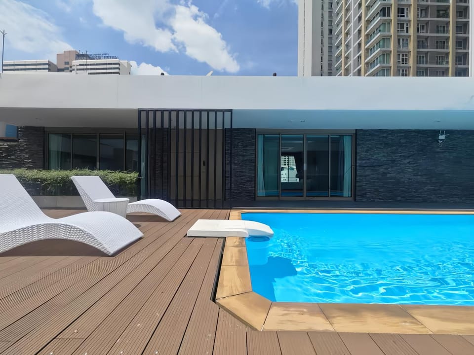 Property building, Patio, Pool view, Swimming pool, sunbed