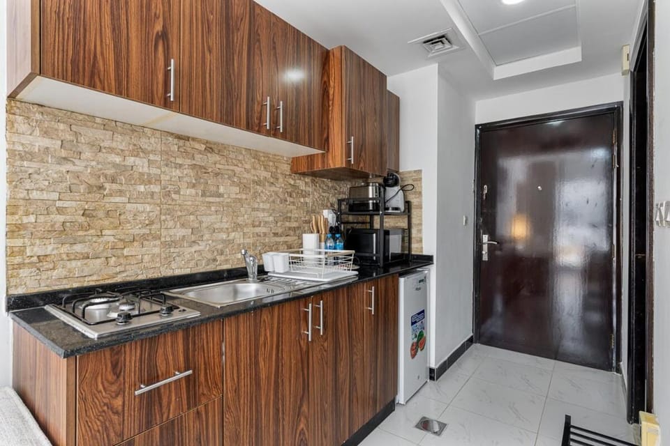 Chic Studio in JVC near Stadium and Miracle Garden Apartment in Dubai