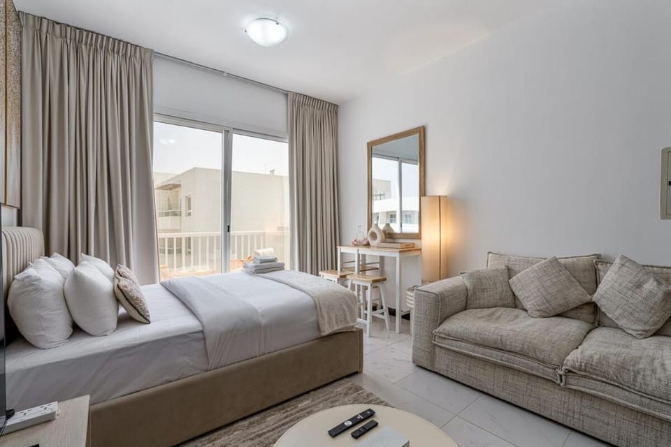 Chic Studio in JVC near Stadium and Miracle Garden Apartment in Dubai