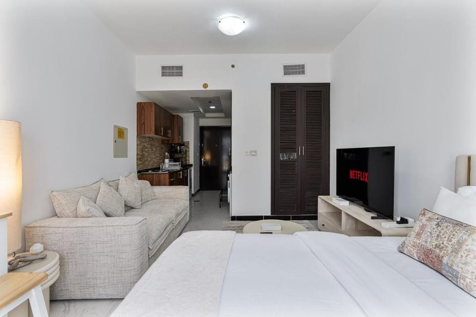 Chic Studio in JVC near Stadium and Miracle Garden Apartment in Dubai