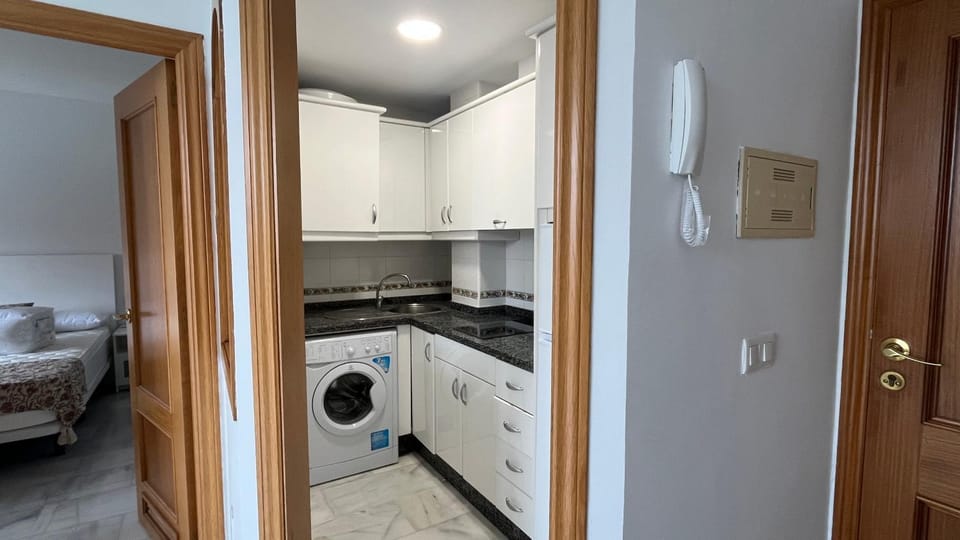 Kitchen or kitchenette, washing machine