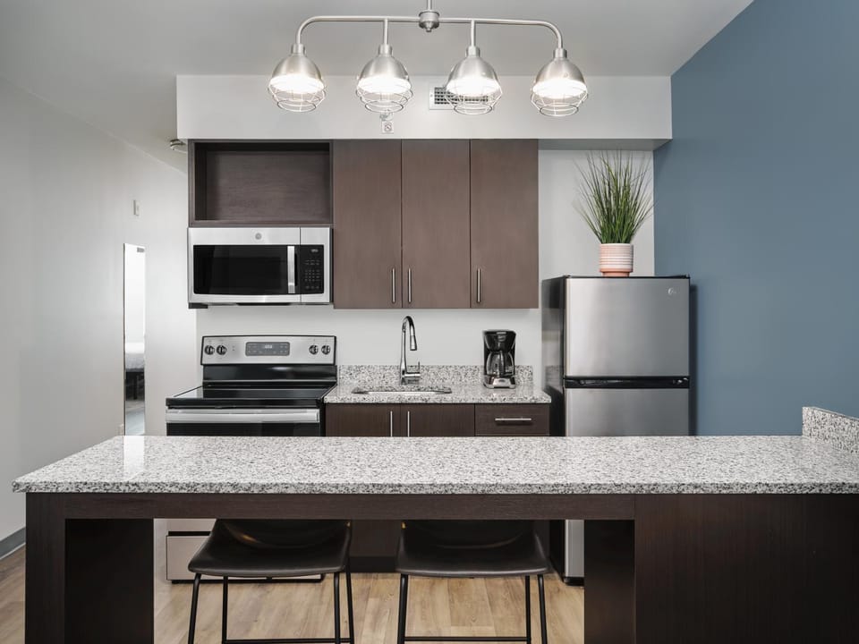 Kitchen or kitchenette, dishwasher, microwave, oven, stove, kitchen